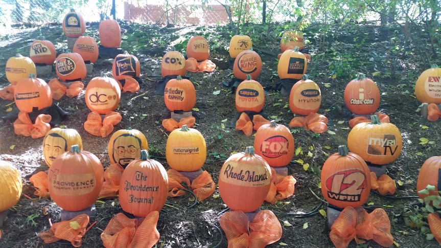 A Genetically Engineered Pumpkin Advertisement, from the Roger Williams Park Zoo in Rhode Island. (Well, they're more of the ordinary painted/carved pumpkins, but it sounds way cooler when you think they might be engineered to produce these writings)